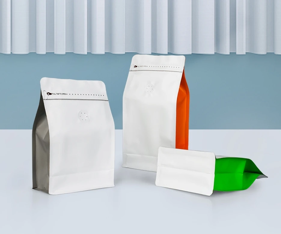 White flat-bottom packaging bags with colorful side panels
