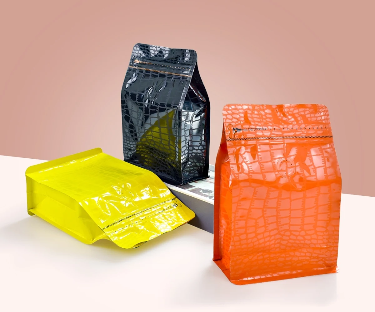Black, orange and yellow textured flat-bottom packaging